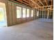 Interior framing of a house under construction, with large windows at 422 Shannon Estates Ct, Plant City, FL 33563