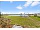 Landscaped backyard with pond view and irrigation system at 44305 Timberland Ter, Punta Gorda, FL 33982