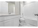 Clean bathroom, featuring a bathtub and vanity with white cabinets at 44305 Timberland Ter, Punta Gorda, FL 33982