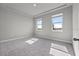 Spacious bedroom with carpet and two large windows at 44305 Timberland Ter, Punta Gorda, FL 33982