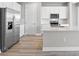 Modern kitchen with stainless steel appliances and white cabinets at 44305 Timberland Ter, Punta Gorda, FL 33982