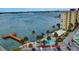Aerial shot showcasing a condo building, pool, and private dock at 4575 Cove Cir # 304, St Petersburg, FL 33708
