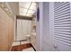Bathroom with shower/tub combo, linen closet, and updated fixtures at 4575 Cove Cir # 304, St Petersburg, FL 33708