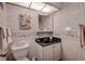 Charming bathroom with seashell theme and granite vanity at 4575 Cove Cir # 304, St Petersburg, FL 33708