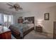 Cozy bedroom with ceiling fan and dresser at 4575 Cove Cir # 304, St Petersburg, FL 33708
