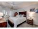 Bedroom with a queen bed, balcony access, and ample closet space at 4575 Cove Cir # 304, St Petersburg, FL 33708