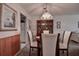 Charming dining room with wooden table and chairs at 4575 Cove Cir # 304, St Petersburg, FL 33708