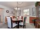 Bright dining room with wood table and chairs at 4575 Cove Cir # 304, St Petersburg, FL 33708