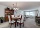 Dining area with round table and four chairs at 4575 Cove Cir # 304, St Petersburg, FL 33708
