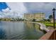 Building exterior showcasing waterfront views and landscaping at 4575 Cove Cir # 304, St Petersburg, FL 33708