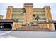 Attractive building exterior with ample parking and landscaping at 4575 Cove Cir # 304, St Petersburg, FL 33708