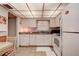 White kitchen with ample counter space and appliances at 4575 Cove Cir # 304, St Petersburg, FL 33708
