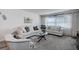 Spacious living room with neutral color palette at 4575 Cove Cir # 304, St Petersburg, FL 33708