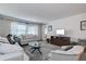 Living room with comfy seating and large windows at 4575 Cove Cir # 304, St Petersburg, FL 33708