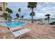 Inviting pool area with lounge chairs and waterfront views at 4575 Cove Cir # 304, St Petersburg, FL 33708