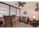 Sunroom with wicker furniture and ceiling fan at 4575 Cove Cir # 304, St Petersburg, FL 33708