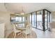 Bright dining area with water view and access to balcony at 5633 Puerta Del Sol S Blvd # 203, St Petersburg, FL 33715