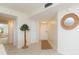 Inviting entryway with a decorative mirror and neutral tones at 5633 Puerta Del Sol S Blvd # 203, St Petersburg, FL 33715
