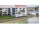 Condo building with water view and balcony at 5633 Puerta Del Sol S Blvd # 203, St Petersburg, FL 33715