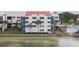 Condo building with water view and balcony at 5633 Puerta Del Sol S Blvd # 203, St Petersburg, FL 33715