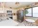 Modern kitchen with stainless steel appliances and water views at 5633 Puerta Del Sol S Blvd # 203, St Petersburg, FL 33715