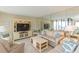 Bright and airy living room with large TV at 5633 Puerta Del Sol S Blvd # 203, St Petersburg, FL 33715