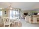 Open living space with dining area and water views at 5633 Puerta Del Sol S Blvd # 203, St Petersburg, FL 33715