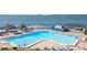 Relaxing pool area with multiple lounge chairs at 5633 Puerta Del Sol S Blvd # 203, St Petersburg, FL 33715