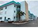 Two-story building with teal accents and parking in front at 5940 30Th S Ave # 209, Gulfport, FL 33707