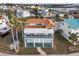 Two-story house with tile roof and waterfront lot at 6423 Driftwood Dr, Hudson, FL 34667