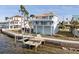 Two-story waterfront home with private dock and beautiful landscaping at 6423 Driftwood Dr, Hudson, FL 34667