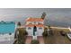Two-story home with terracotta roof and waterfront access at 6423 Driftwood Dr, Hudson, FL 34667