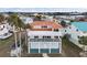Two-story home with terracotta roof, balcony and waterfront views at 6423 Driftwood Dr, Hudson, FL 34667