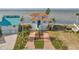 Two-story waterfront home with a large driveway and boat parking at 6423 Driftwood Dr, Hudson, FL 34667