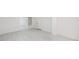 Unfinished basement area with tiled flooring at 6423 Driftwood Dr, Hudson, FL 34667