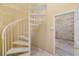 Unfinished basement with spiral staircase and block walls at 6423 Driftwood Dr, Hudson, FL 34667