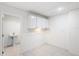 Basement laundry area with white cabinets at 6423 Driftwood Dr, Hudson, FL 34667