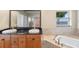 Bathroom with double vanity and corner soaking tub at 6423 Driftwood Dr, Hudson, FL 34667