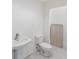 Simple, clean basement bathroom with pedestal sink at 6423 Driftwood Dr, Hudson, FL 34667