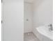 Unfinished basement bathroom with pedestal sink at 6423 Driftwood Dr, Hudson, FL 34667