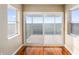 Bedroom with sliding glass doors and hardwood floors leading to a waterfront deck at 6423 Driftwood Dr, Hudson, FL 34667