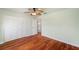 Bedroom featuring hardwood floors and ceiling fan at 6423 Driftwood Dr, Hudson, FL 34667