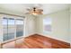 Bright bedroom with water views, hardwood floors, and sliding glass doors leading to a deck at 6423 Driftwood Dr, Hudson, FL 34667