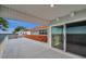 Spacious deck with sliding doors, water views, and partial home view at 6423 Driftwood Dr, Hudson, FL 34667