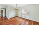 Bright dining room with hardwood floors and elegant chandelier at 6423 Driftwood Dr, Hudson, FL 34667