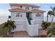 Beautiful waterfront home with a two-car garage and a tiled roof at 6423 Driftwood Dr, Hudson, FL 34667