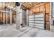 Unfinished two-car garage with concrete floor and open space at 6423 Driftwood Dr, Hudson, FL 34667