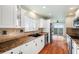 Kitchen boasts granite countertops, stainless steel appliances, and water views at 6423 Driftwood Dr, Hudson, FL 34667