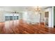 Bright living room with hardwood floors, spiral staircase, and water views at 6423 Driftwood Dr, Hudson, FL 34667