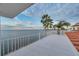 Spacious rooftop deck with water views and palm trees at 6423 Driftwood Dr, Hudson, FL 34667